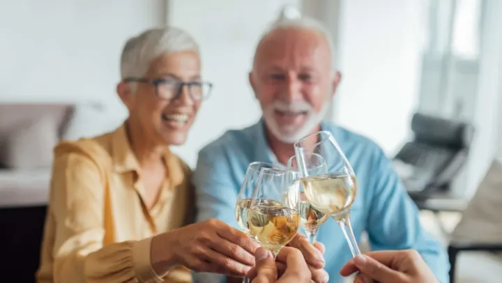 group of elderly people drinking together